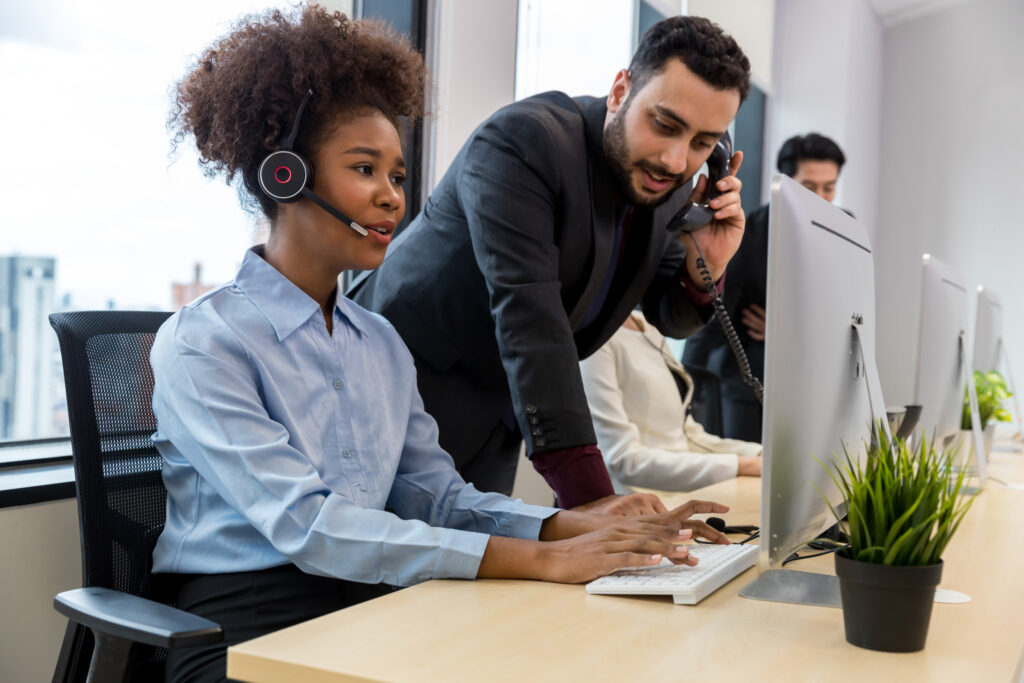 Office staff making calls through a cloud-based PBX interface provided by KLR